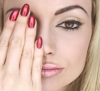 Rosanna Davison wearing Gelish 'Gelish red “Good Gossip'